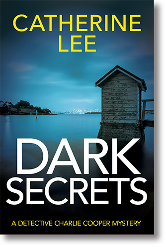 Book Cover for Dark Secrets (A Detective Charlie Cooper Mystery) by author Catherine Lee, showing a brooding, blue-tinged view of an old boathouse on the shore of Sydney Harbour